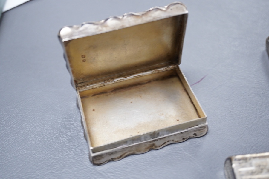 A Victorian silver ovoid snuff box, Henry William Dee, London, 1874, 58mm, together with two George V silver snuff boxes.